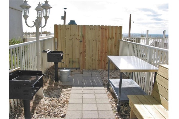 BBQ area located by outdoor pool