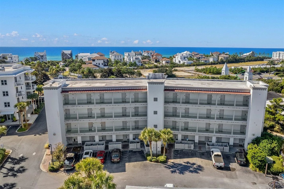 Our studio condo is located on the ground floor for easy access. While it may feel like you're entering from the front, you're actually entering through the back of the building.  This parking lot pictured is the front of the building.  