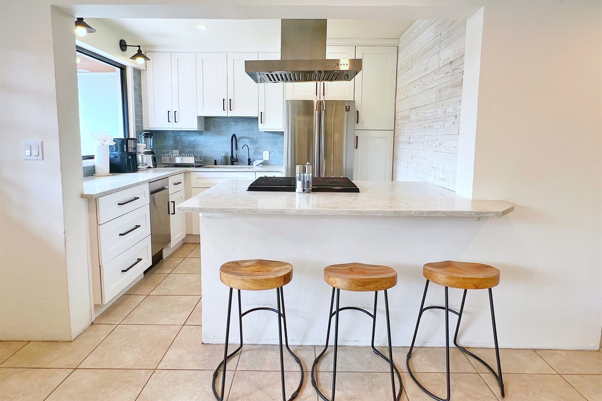 Start your day at the sleek breakfast bar, perfect for a quick coffee or casual meal. 