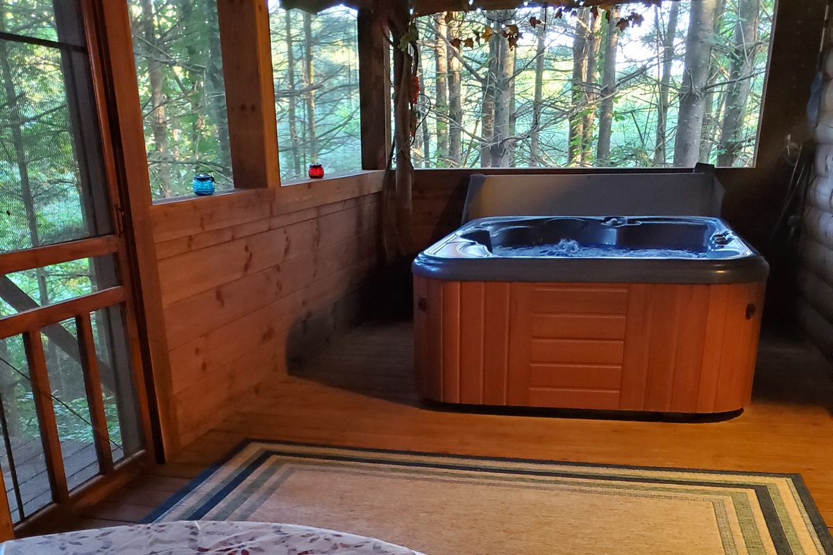 Enjoy the screened-in deck with a hot tub.