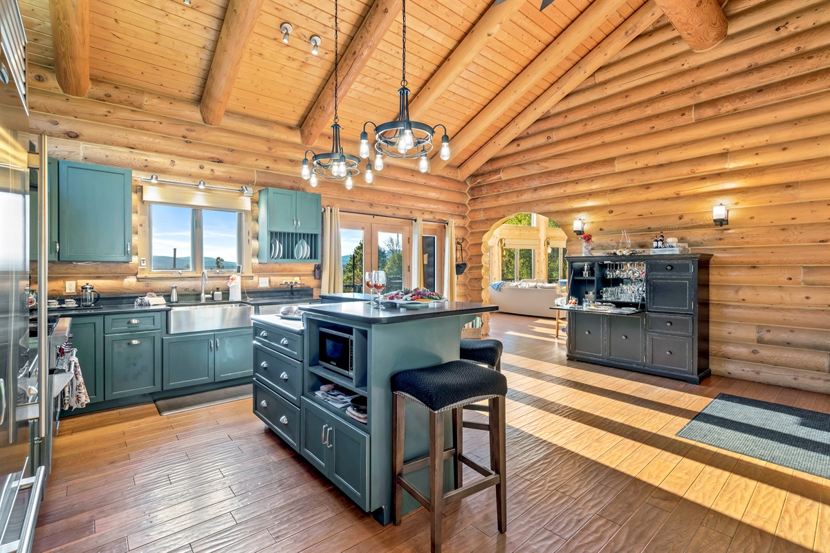 Bright, open kitchen with a bar and dining space.