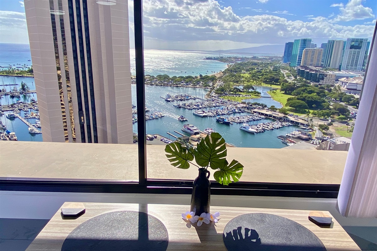 Wake up to this breathtaking view of the Ala Wai Boat Harbor and the endless Pacific horizon. Enjoy your morning coffee or evening wine while watching sailboats drift beneath the Hawaiian sun — the perfect start and finish to each day in paradise.