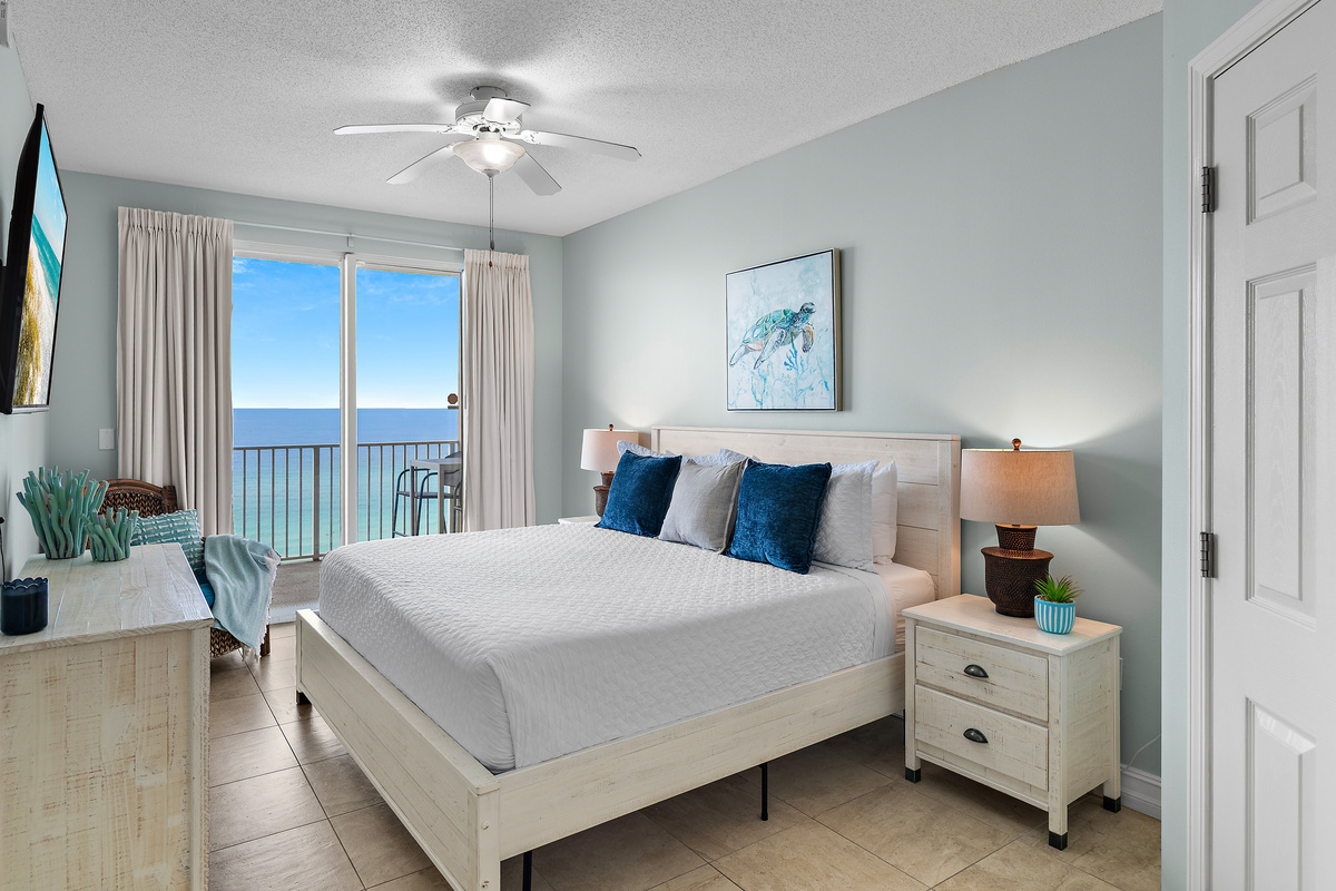 Spacious master bedroom features a King bed, Gulf views, balcony access, SMART TV w/ cable access, bathroom with dual vanity and shower/tub combo, and large closet.