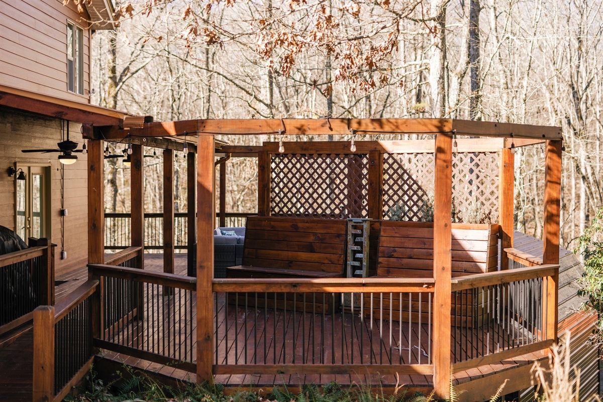 Relax on the deck taking in the peaceful wooded surroundings