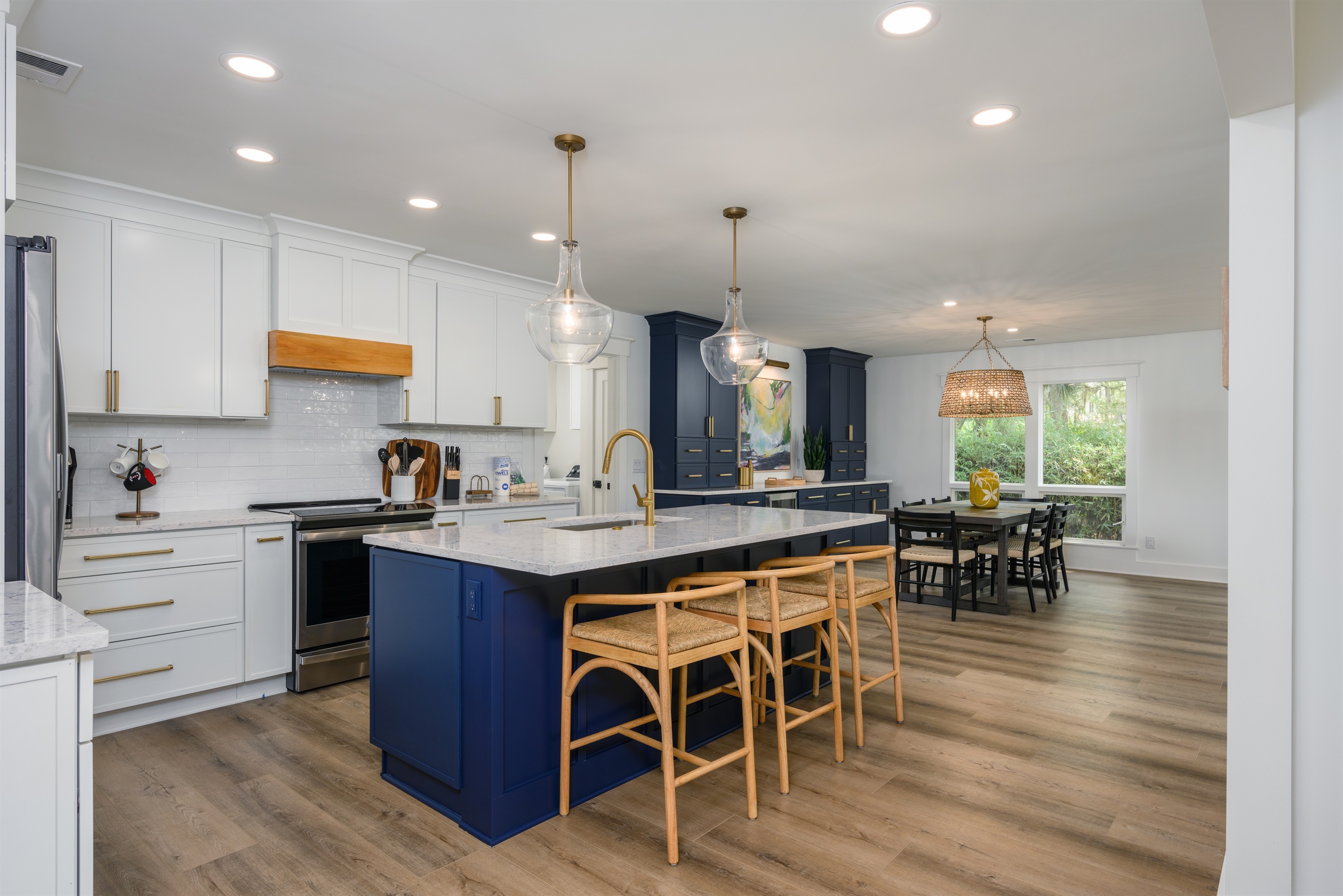 Beautifully updated kitchen. Open floor plan keeps you connected with those in the family room and has a great view of the deck and pool!