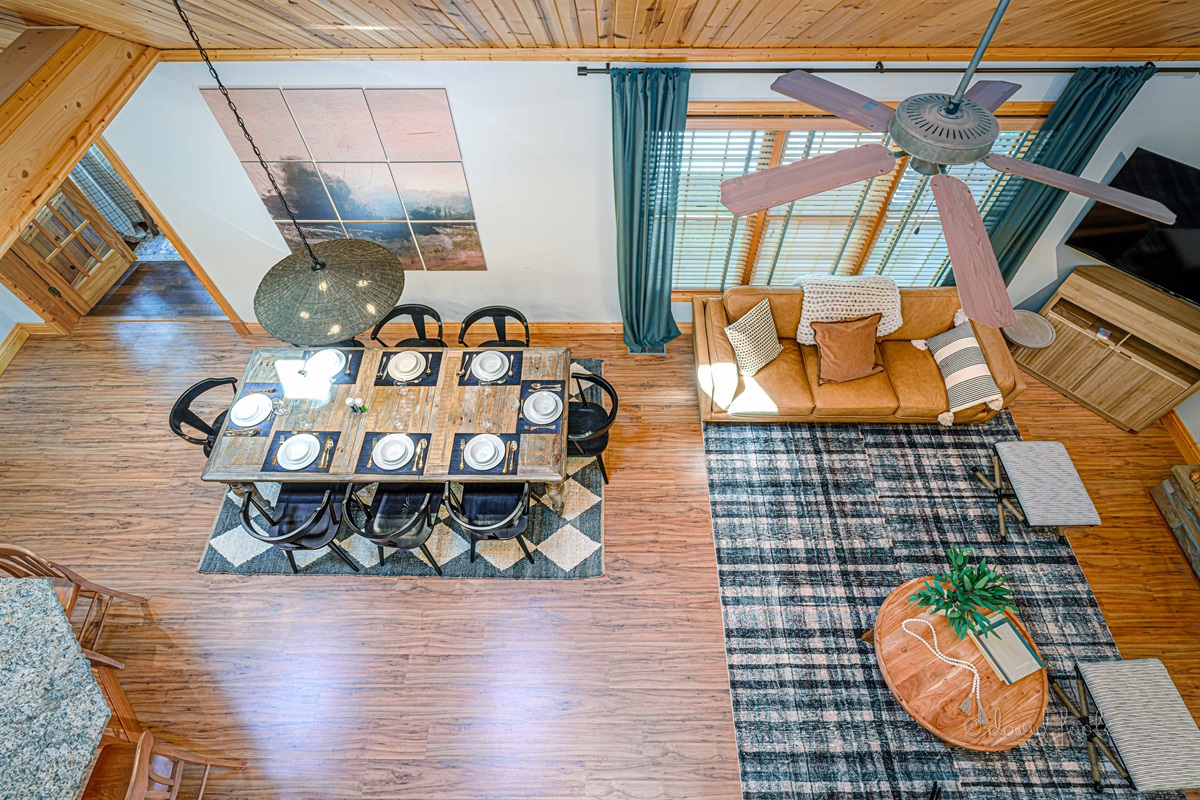 Open kitchen/dining/living room with vaulted ceiling for catching up with family and friends