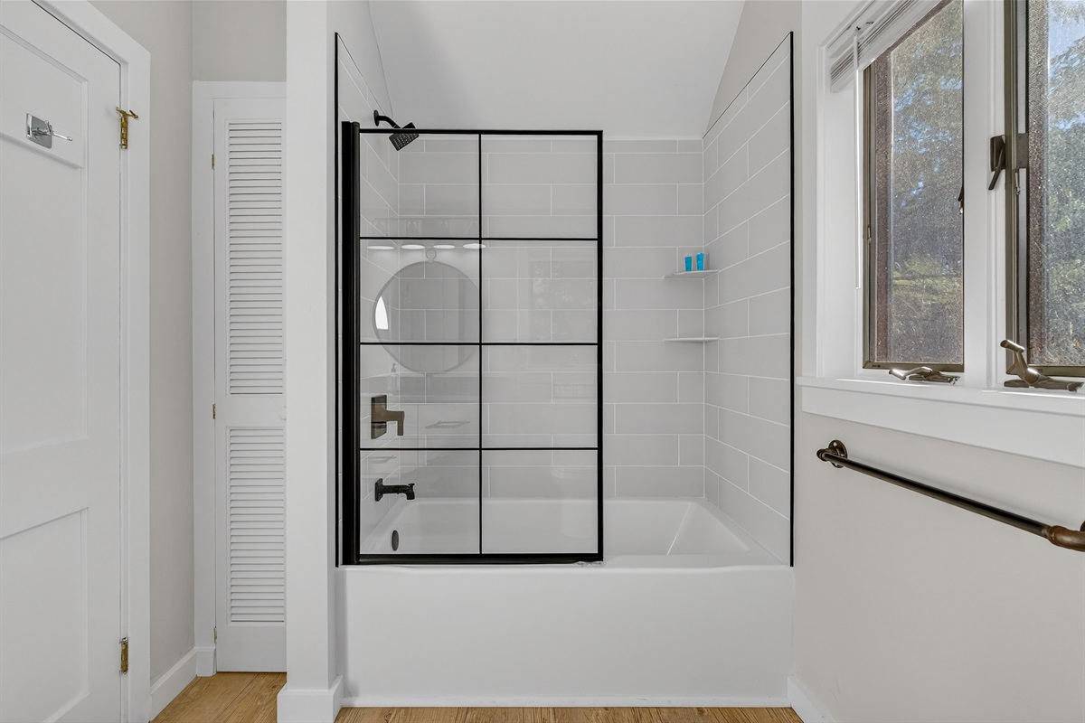 Bathroom with full shower and bathtub off of the main bedroom.