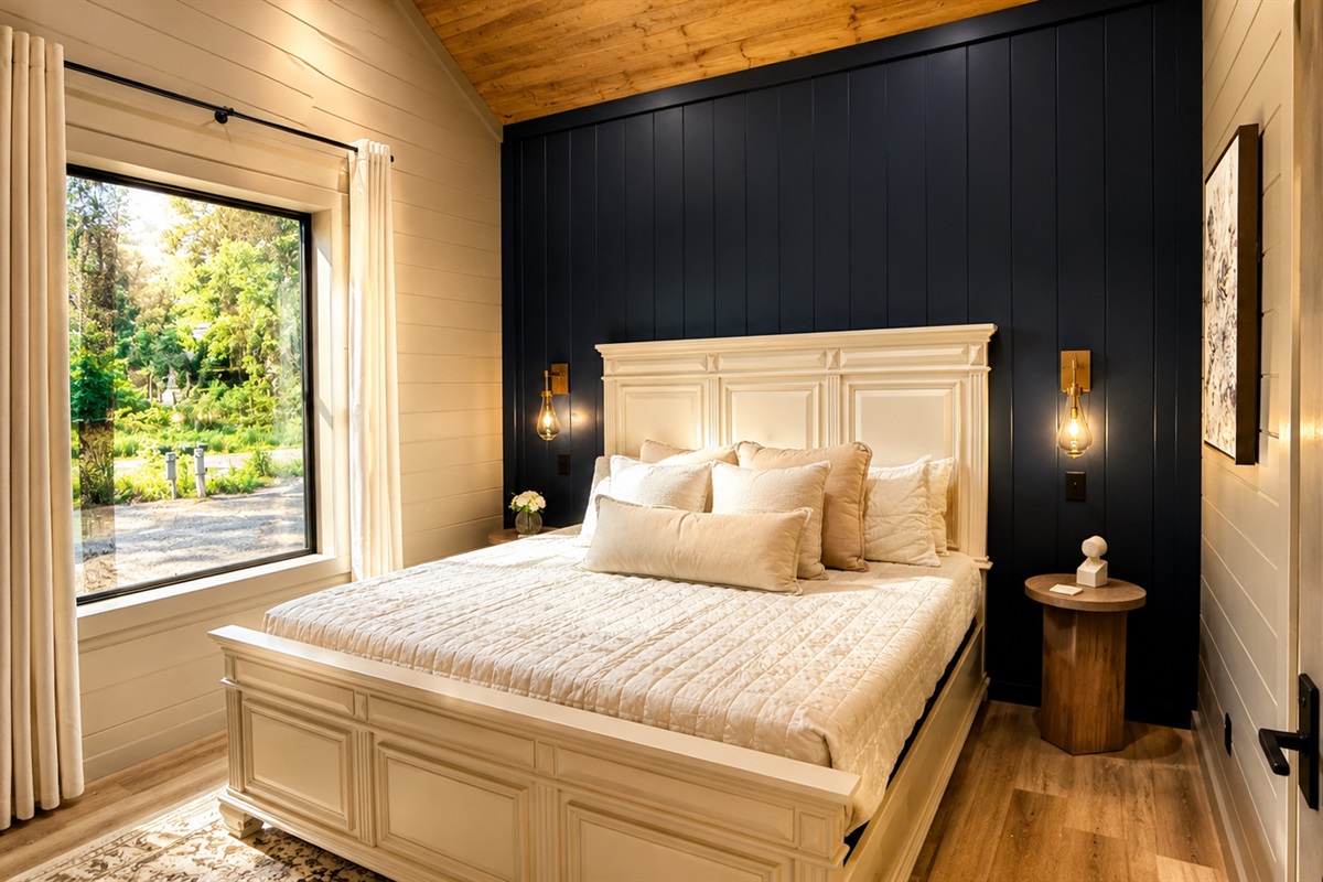 Bedroom Retreat: Elegant decor and tranquil views create the perfect escape for relaxation!