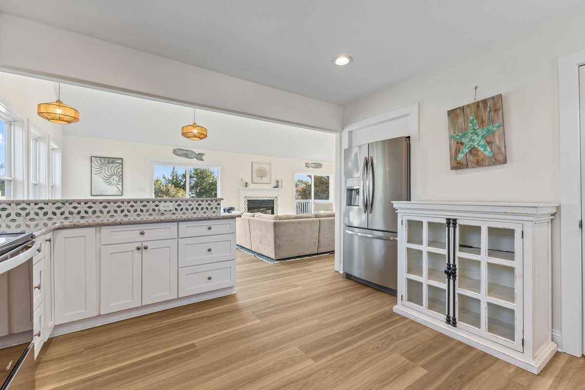 An open layout keeps the kitchen and living spaces connected, so no one has to miss a moment together