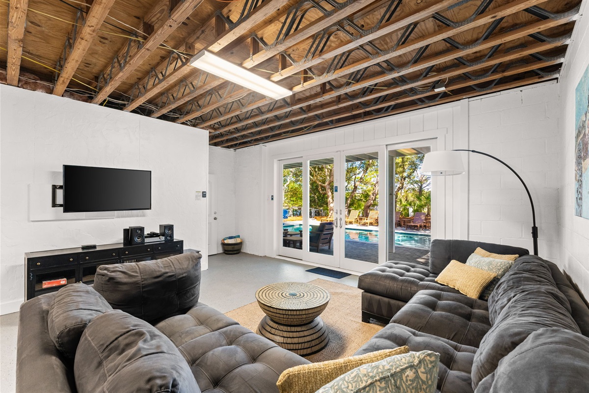 The hangout features seating and large TV—for movie marathons in Side B lounge.