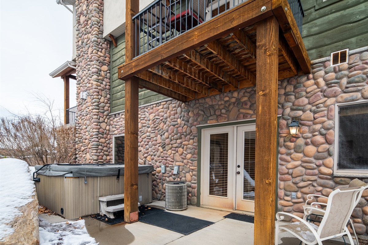 Patio with hot tub and private outdoor space