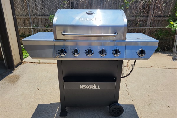 A dedicated outdoor area featuring a state-of-the-art BBQ grill, perfect for hosting memorable cookouts and savoring delicious grilled favorites.