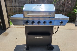 A dedicated outdoor area featuring a state-of-the-art BBQ grill, perfect for hosting memorable cookouts and savoring delicious grilled favorites.