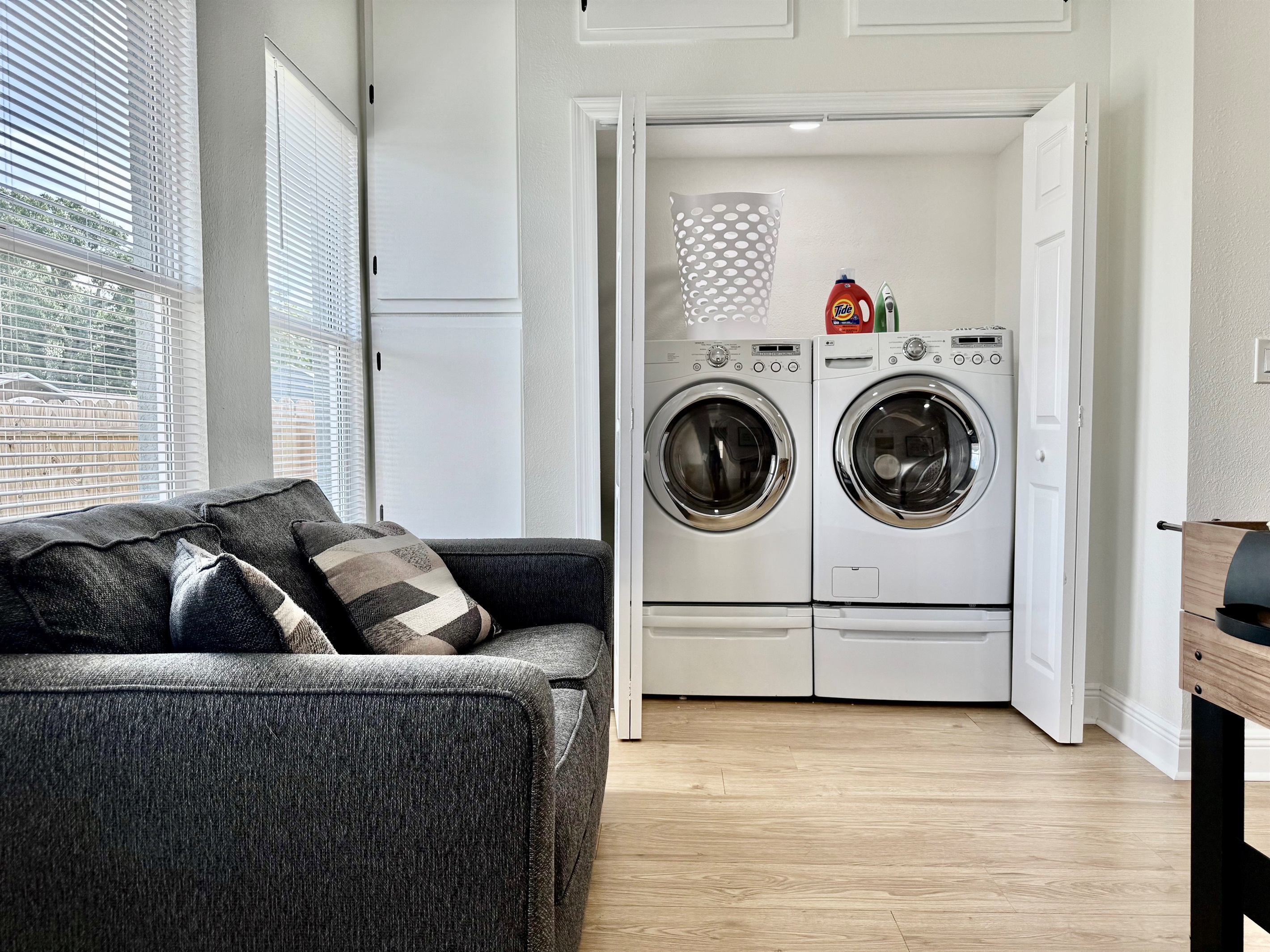 Skip the laundromat! This private laundry closet offers full-size machines, a laundry basket, and all the essentials you need—just steps from the bathroom and bedrooms.