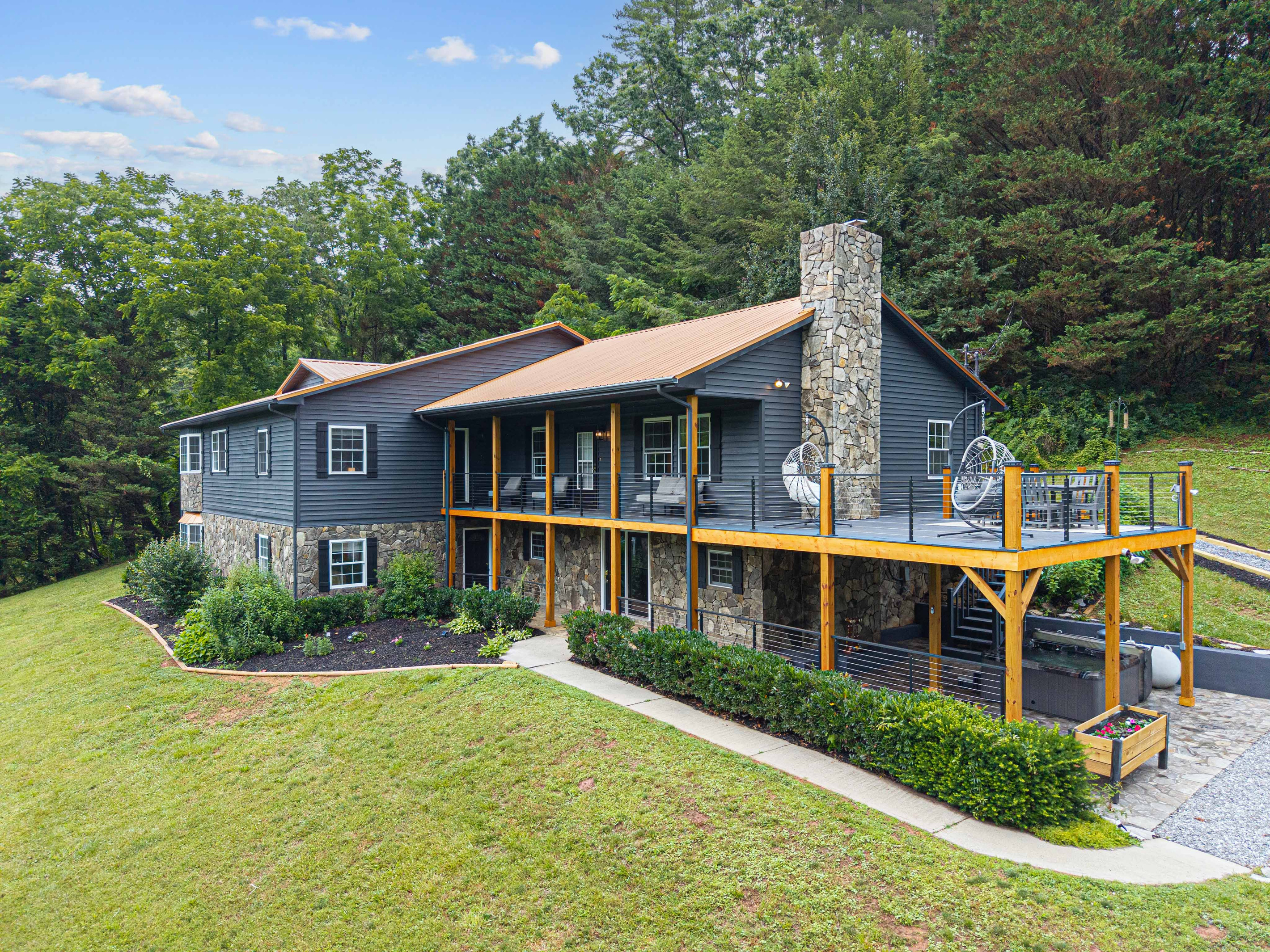 Scenic retreat with stunning views, spacious deck, and charming stone accents!