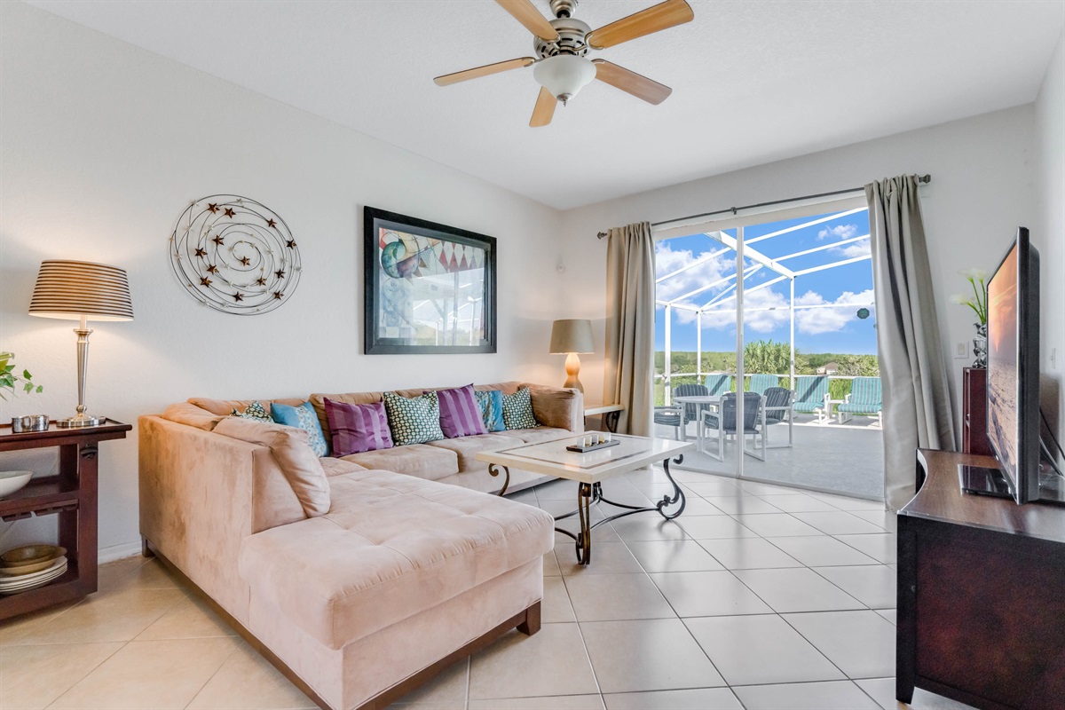 The sitting room is bathed in light from the pool deck doors!