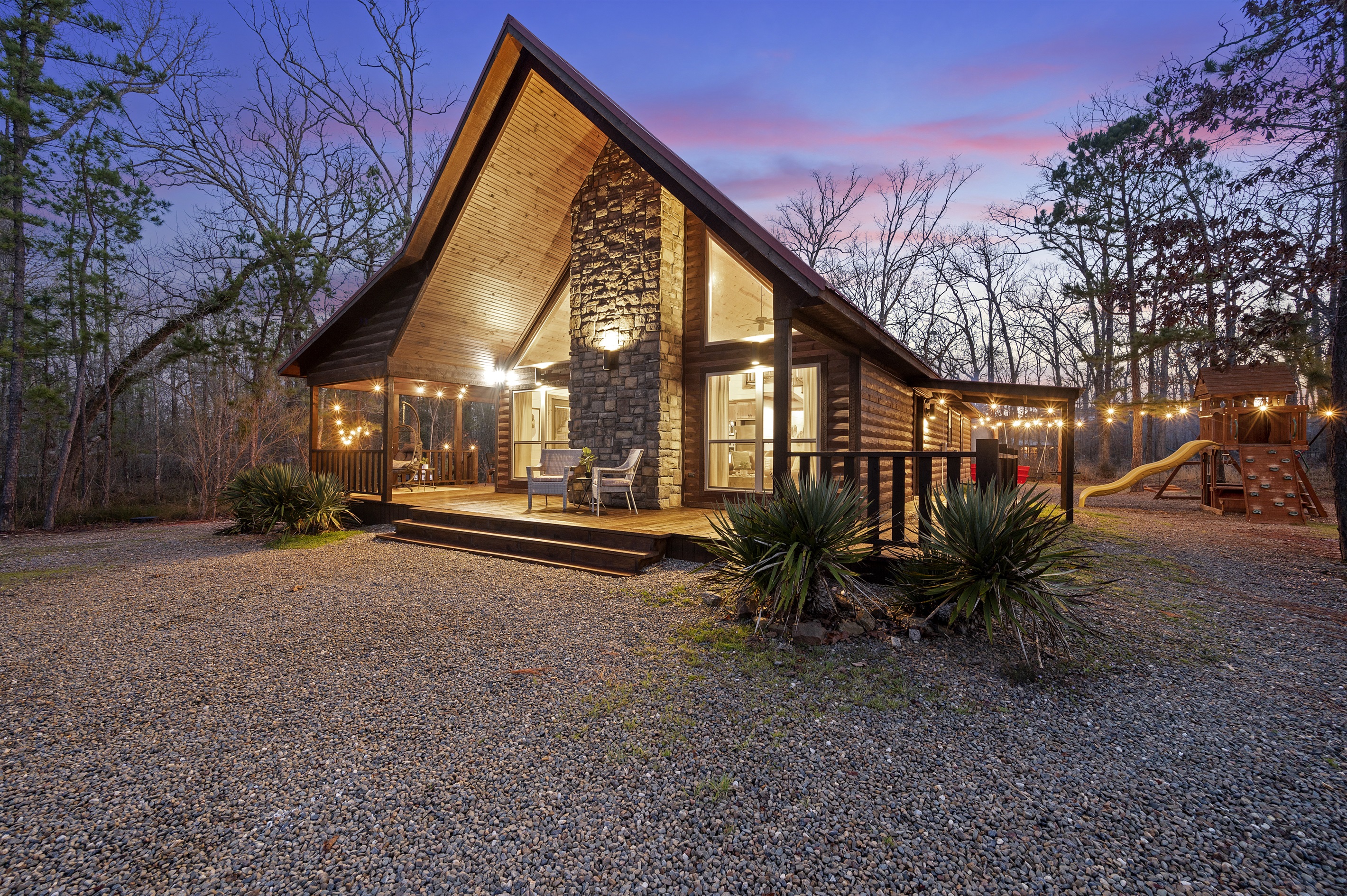 Welcome to your cozy haven nestled among the pines - unwind on our charming cabin front porch and let nature's symphony soothe your soul