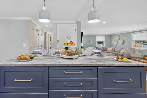Oversized island offering plenty of room for cooking, serving, and gathering.