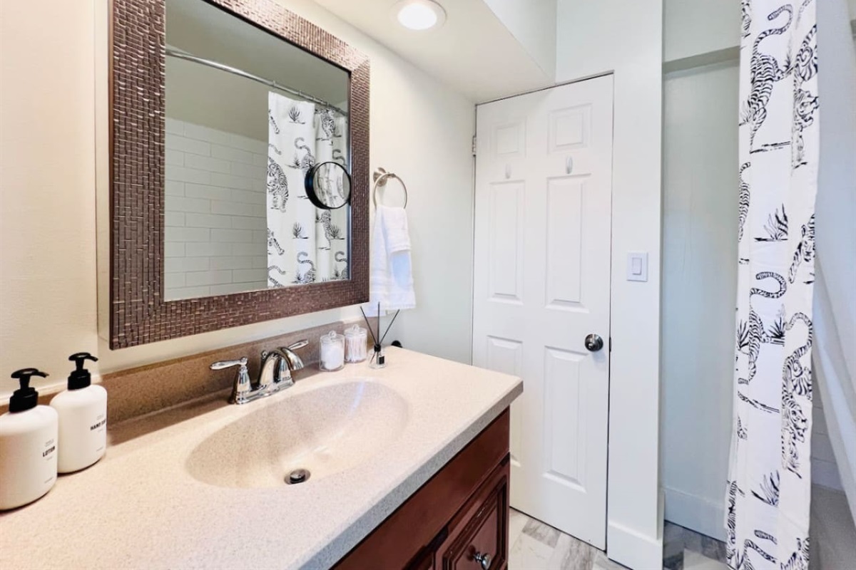 Modern full bathroom, featuring sleek fixtures and all the amenities you need for a comfortable and refreshing experience.