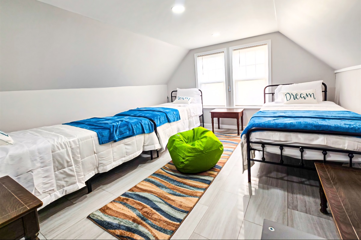 4th bedroom on the 3rd floor with 3 twin beds