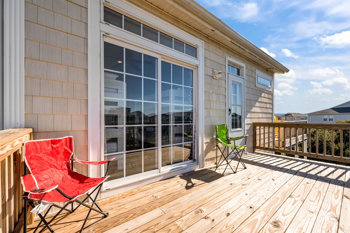 This sun-drenched deck is calling your name to enjoy the breeze and views!