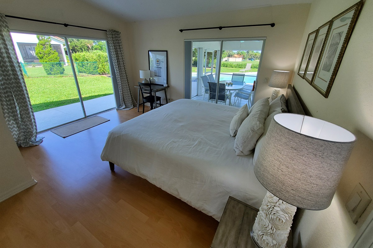 2nd King bedroom with access to lanai and yard; desk and chair