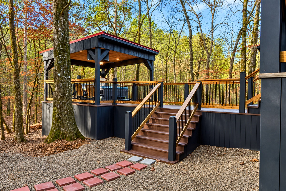 Rustic wood details and covered entry steps give the cabin an inviting first impression from the moment you arrive.