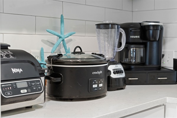 Fully stocked kitchen with Ninja air fryer/grill, toaster, crockpot, blender, dual function Keurig, and dishes, silverware, including kids dishes 