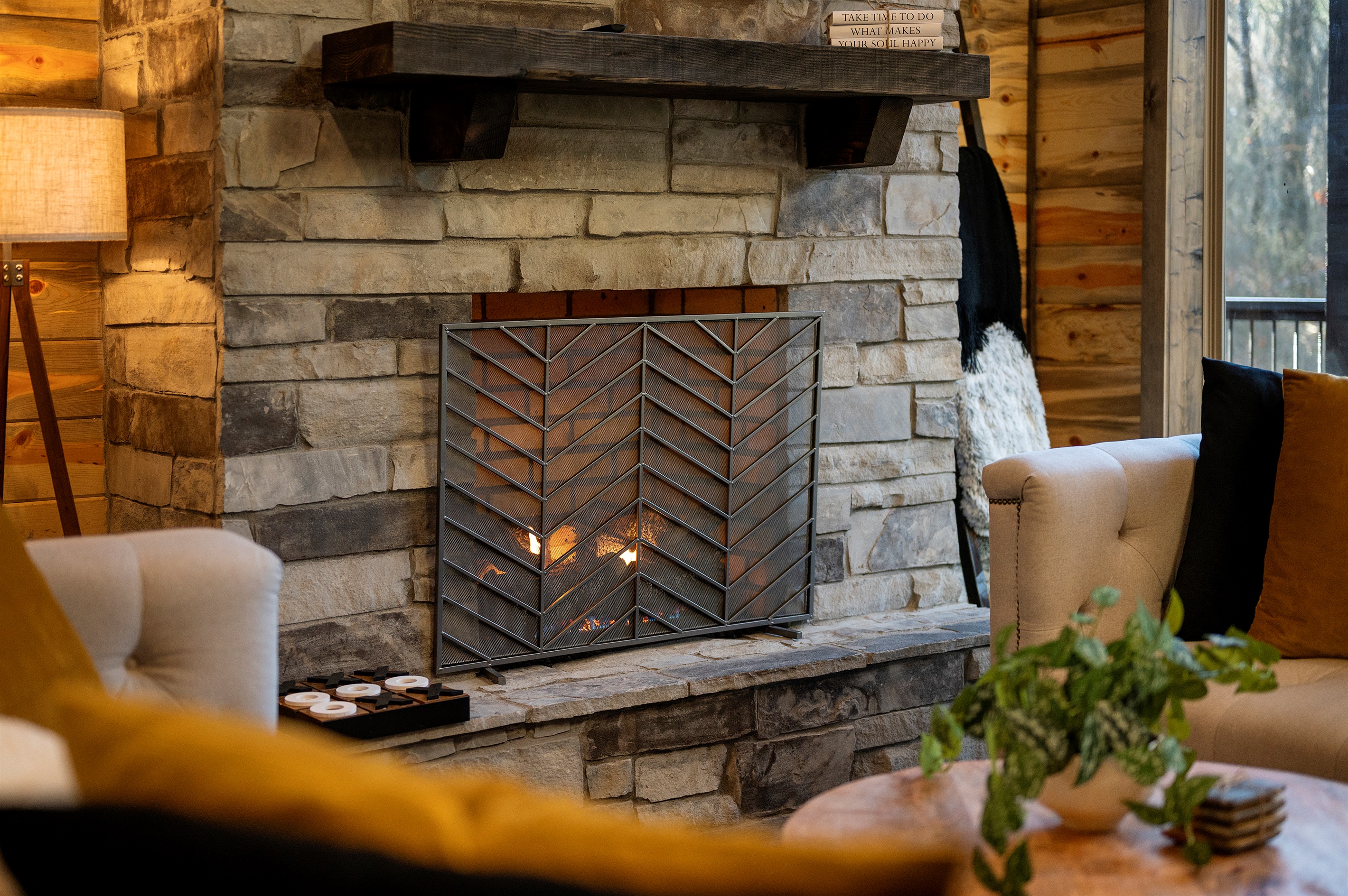 Relax by the stone fireplace and enjoy cozy evenings together.