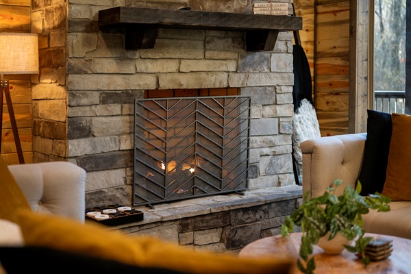 Relax by the stone fireplace and enjoy cozy evenings together.