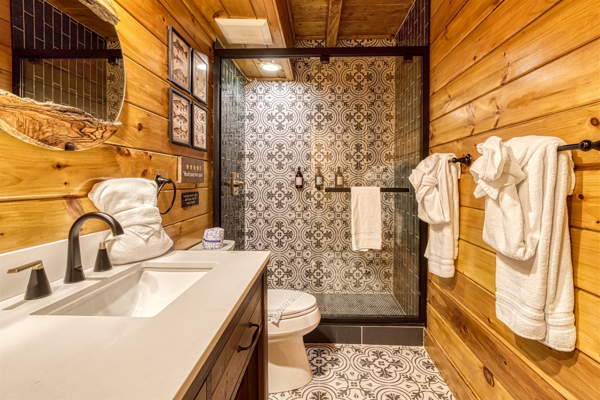 Shower in common bathroom on the main level