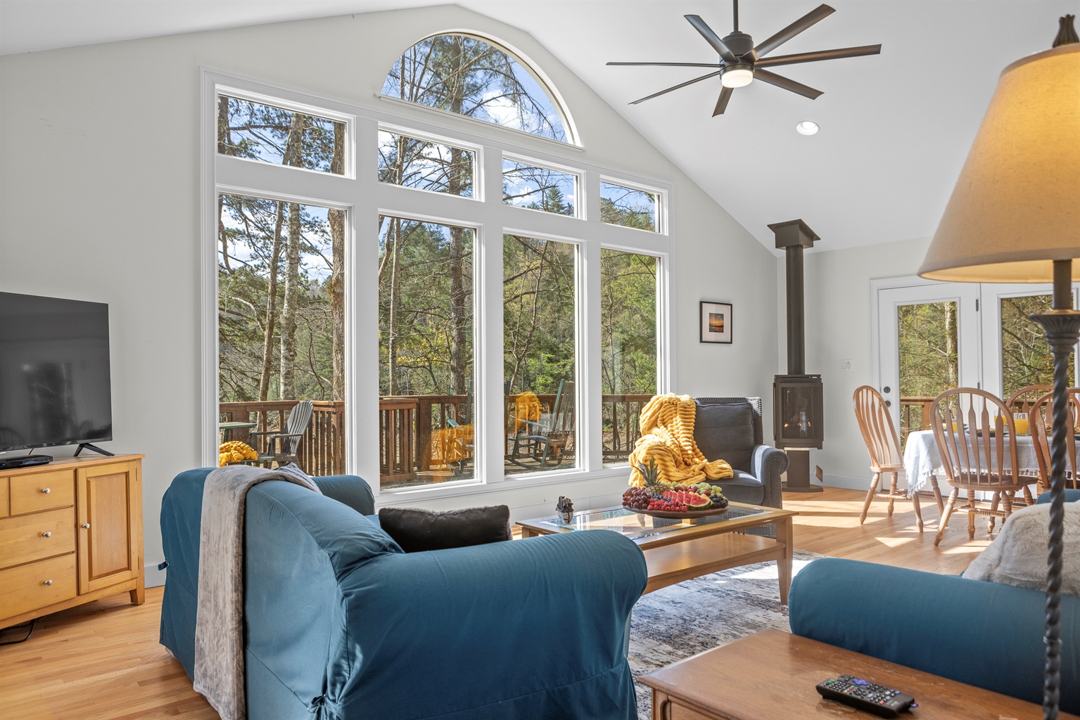 Living Room: Enjoy stunning forest views and bright natural light in this stylish gathering space!