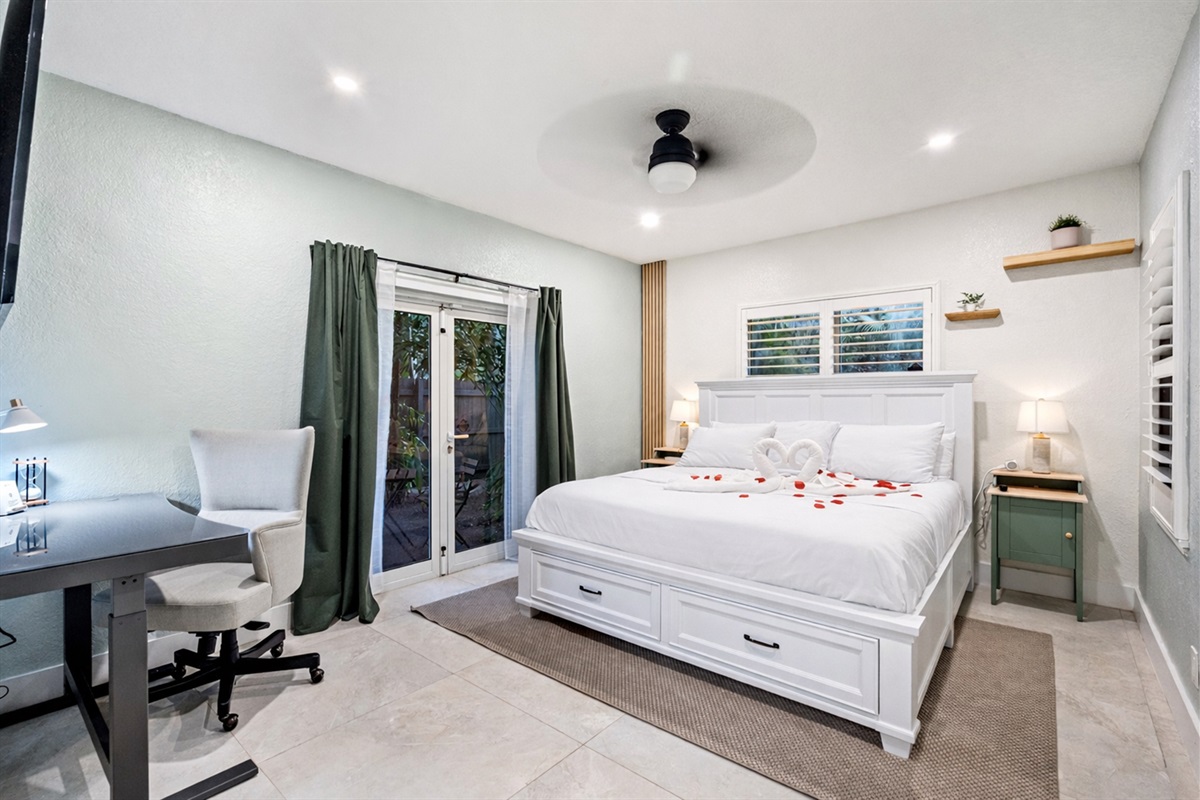 Spacious master retreat with ensuite bath and your own TV escape 🛏️.  Exit to your own private courtyard!