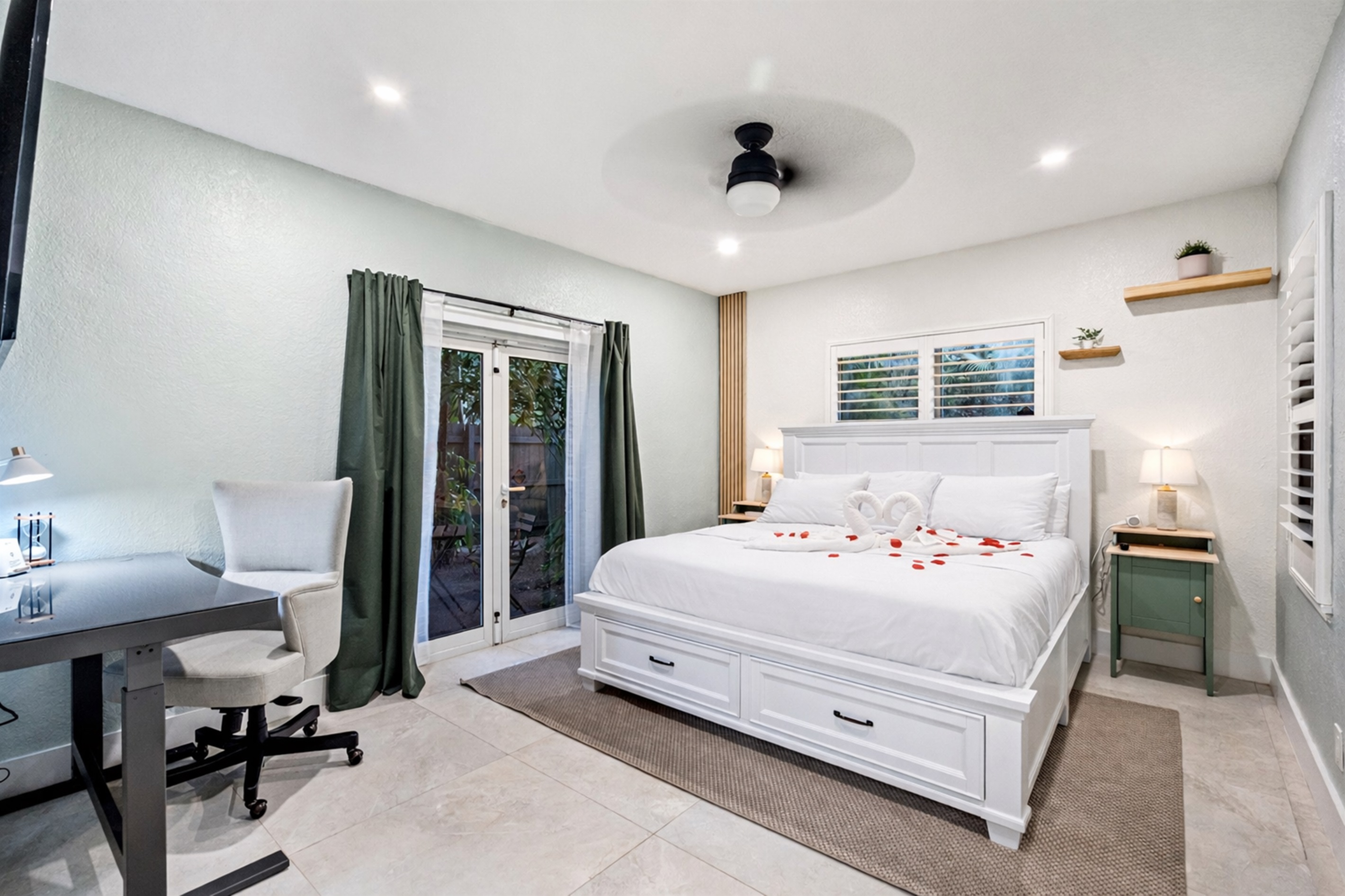 Spacious master retreat with ensuite bath and your own TV escape 🛏️.  Exit to your own private courtyard!