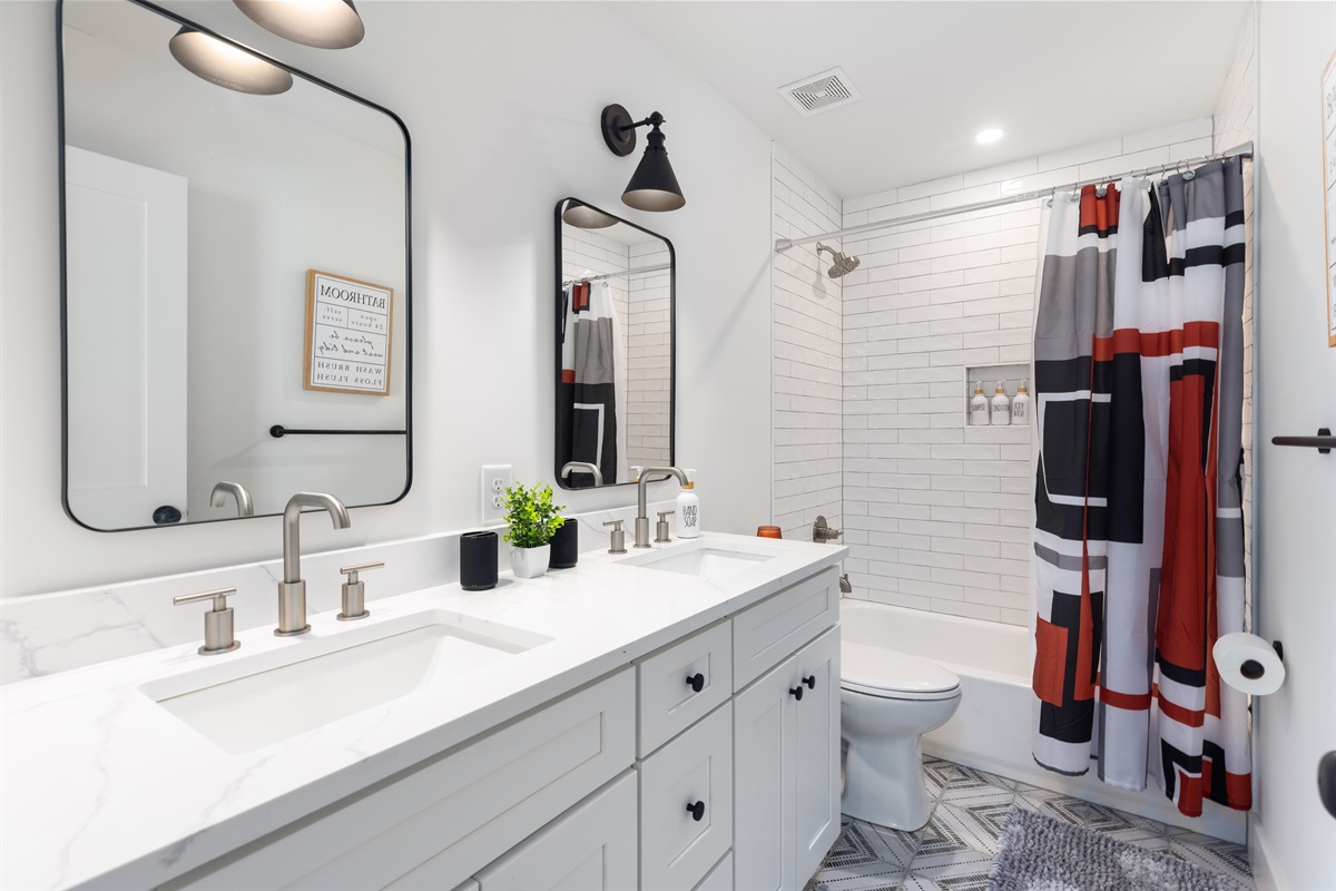 The upstairs full bathroom has shower/tub combination and two sinks. Plenty of room for your entire group!
