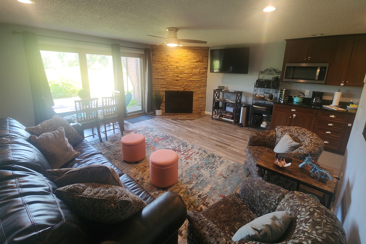 Open concept living room with views to patio