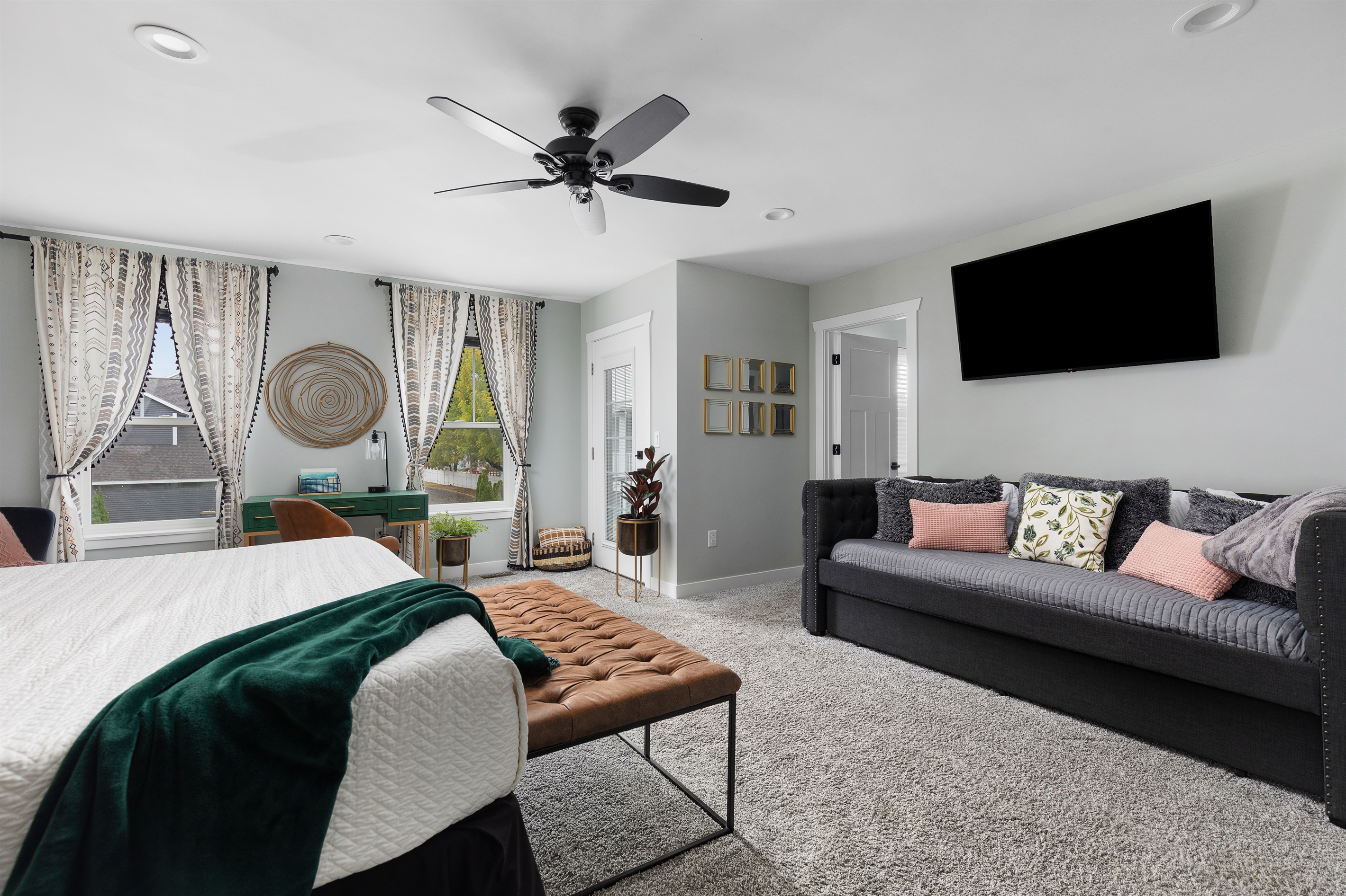 Primary bedroom- king bed, day bed with trundle pull out, TV, balcony and attached full bathroom