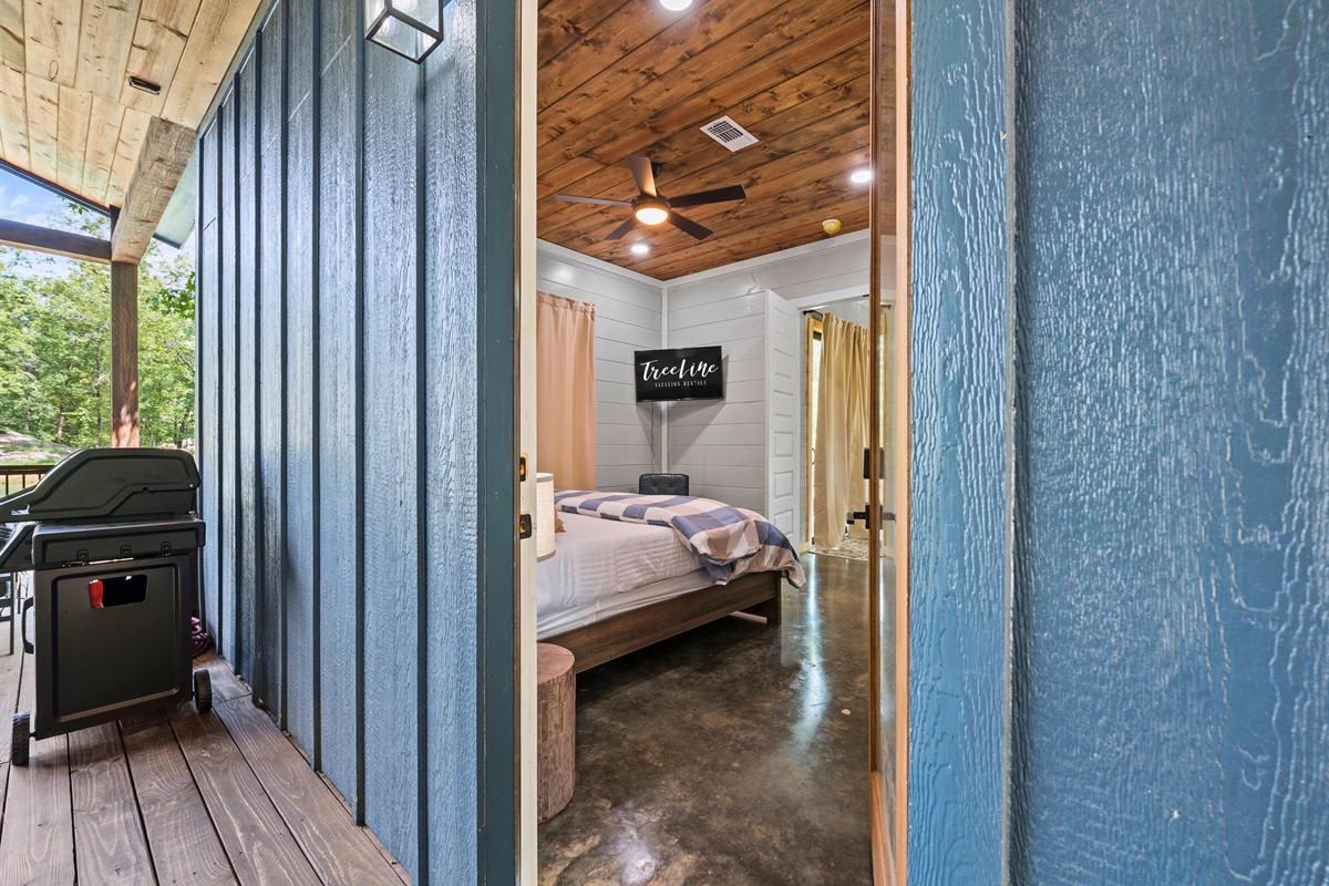 Step into the small house where the comforts of a luxurious bed blend seamlessly with the allure of the outdoors.