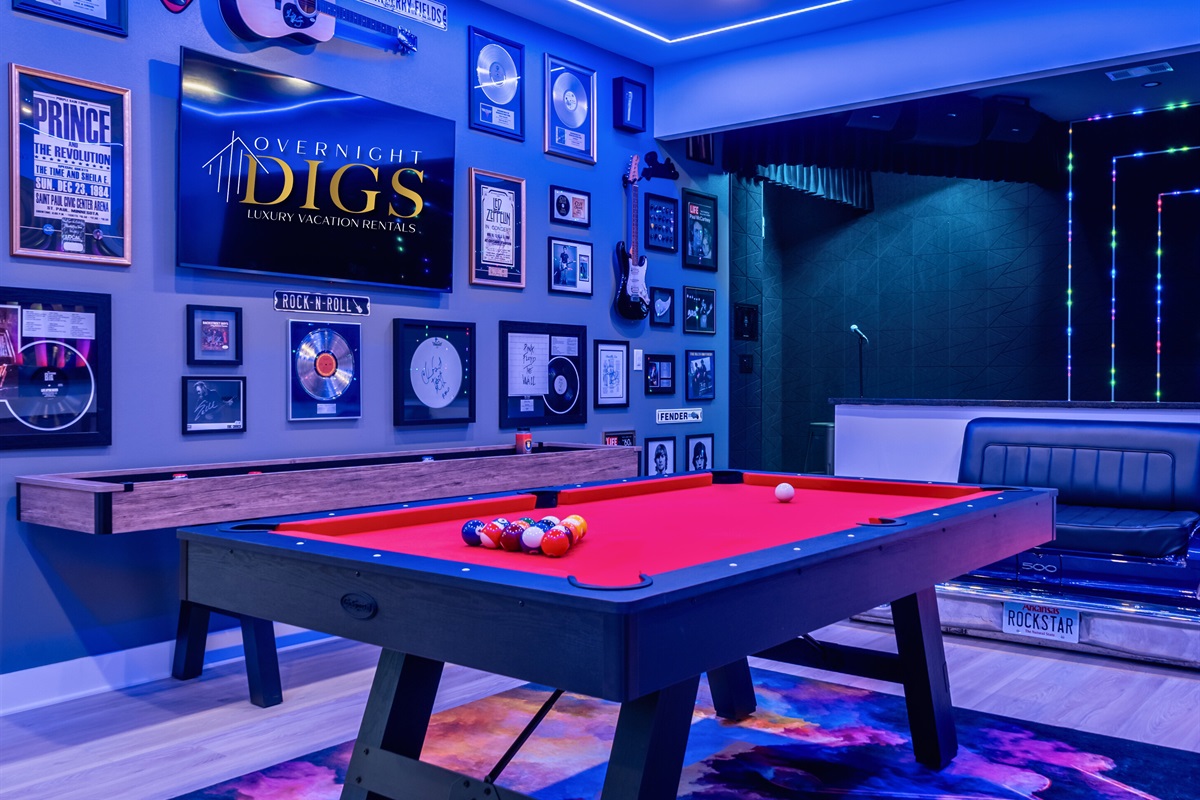 Rock and roll memorabilia add a cool, retro vibe, enhancing the room's energetic feel.