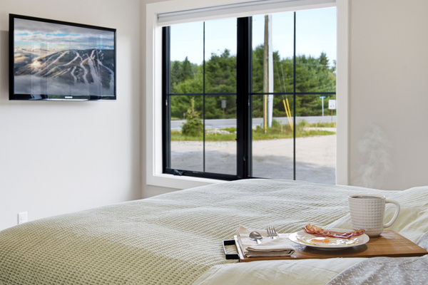 Wake up to natural light and tranquil views of the surrounding greenery.