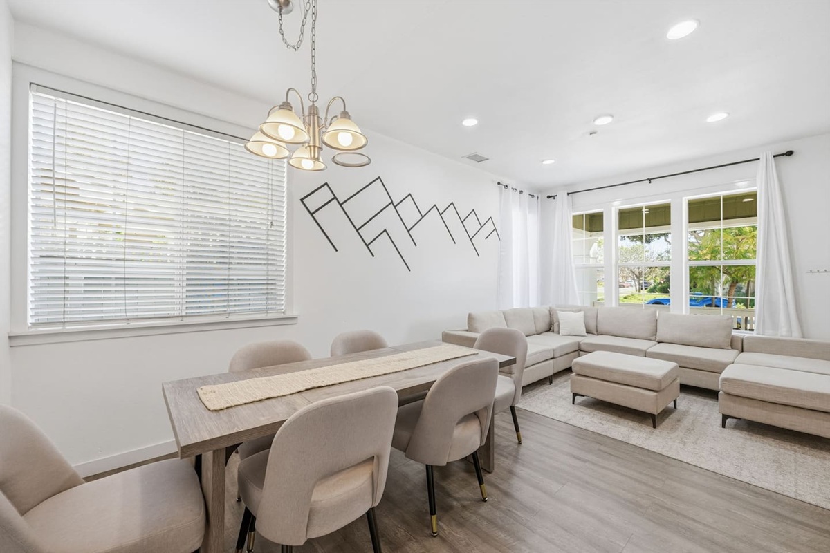 Dining table seats the whole group with pendant lighting and open sightlines to the living room. Ideal for family meals. 4-bedroom beach house near Channel Islands Harbor.