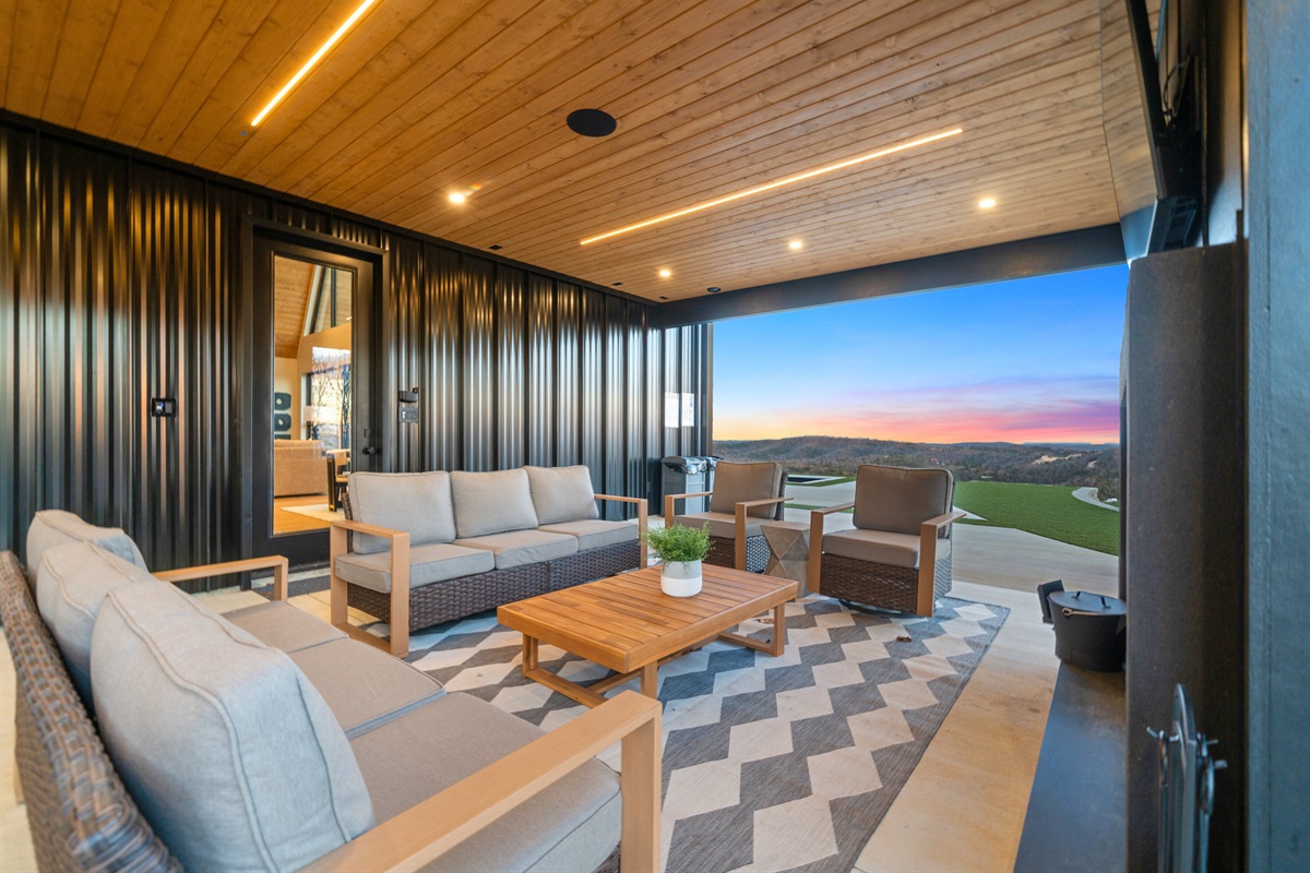 This covered outdoor area is designed for comfort, with plenty of seating to stretch out, relax, and enjoy the mountain vibe no matter the season.