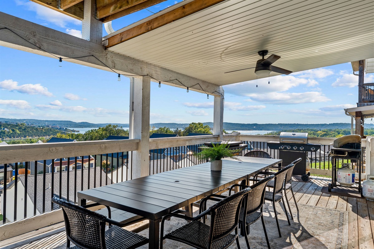 2 Grills and a blackstone next to the outdoor dining table!