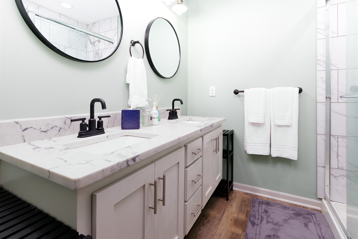 Modern ensuite bath exclusively serving the primary bedroom for added privacy and convenience.