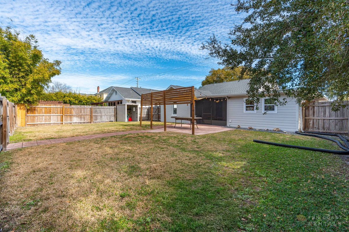 Fully Fenced Backyard with string lights