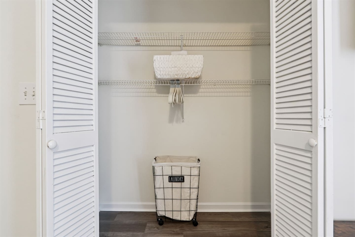Master bedroom featuring a comfortable king bed and an Amazon Fire-powered Smart TV. The shared bathroom is conveniently right next door. This room includes 2 full-body towels, 2 washcloths, and 2 hand towels for your stay.