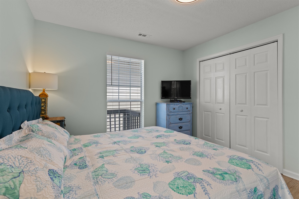 Primary Bedroom with King bed, ensuite bathroom and Smart TV