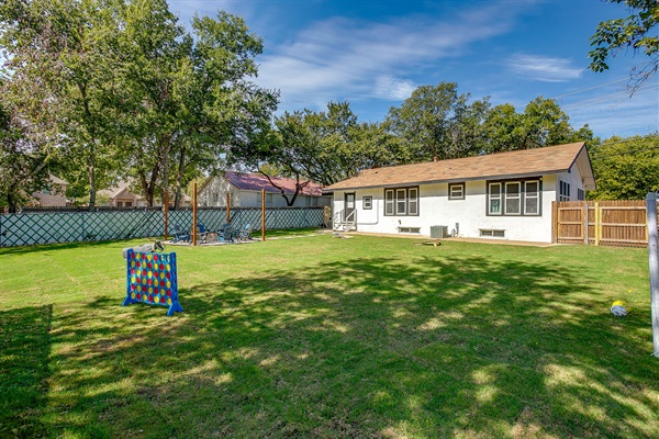 Endless green space for kids, pets, and games—this yard has room to roam