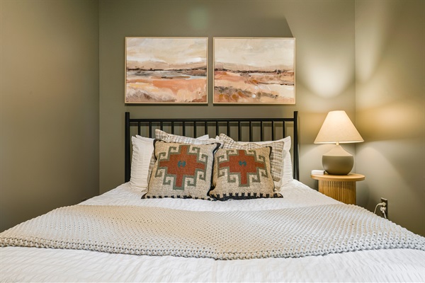 Queen bedroom offering both comfort and style