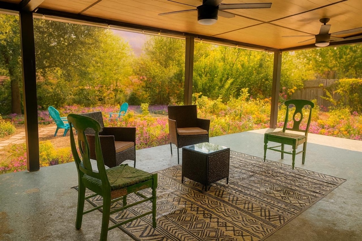 Patio with seats, sunset and garden view, TV, game, and patio string lights